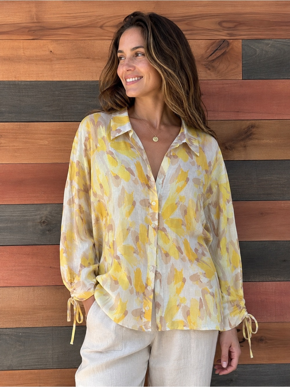 Cream and yellow summer linen-blend shirt is from the JM Collection.